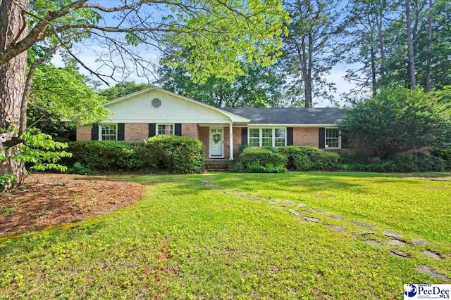 1817 E Sandhurst Dr, Florence, SC 29505 - single story home featuring brick siding and a front yard