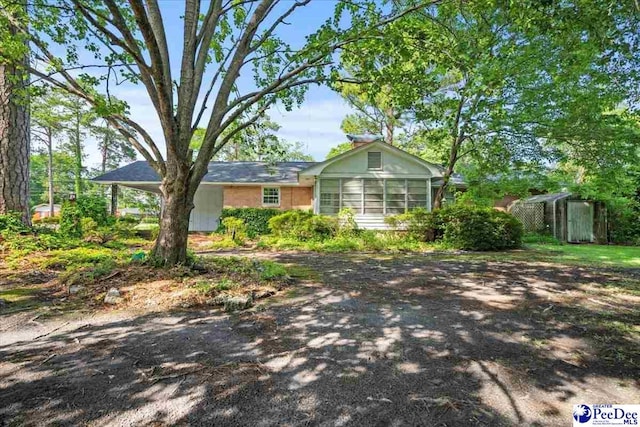 1817 E Sandhurst Dr, Florence, SC 29505 - ranch-style home featuring a storage shed