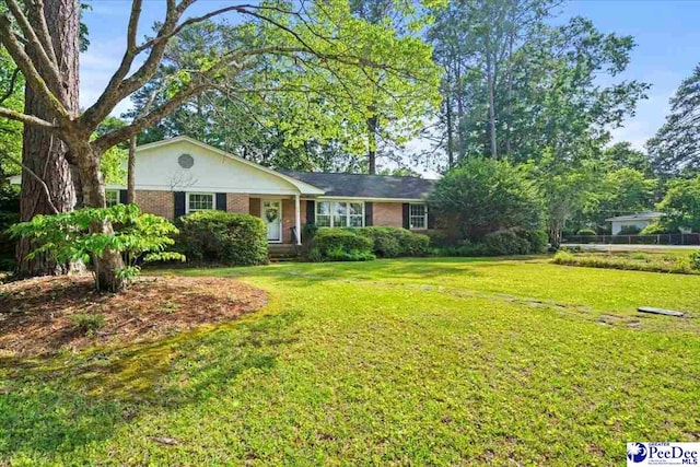 1817 E Sandhurst Dr, Florence, SC 29505 - ranch-style house featuring brick siding and a front lawn