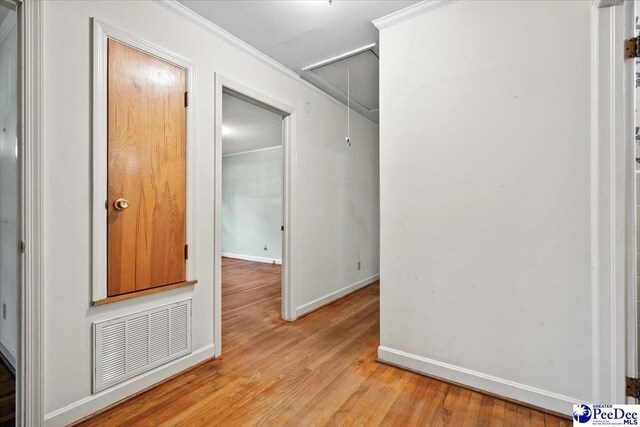 1817 E Sandhurst Dr, Florence, SC 29505 - hall featuring attic access, light wood finished floors, baseboards, and crown molding