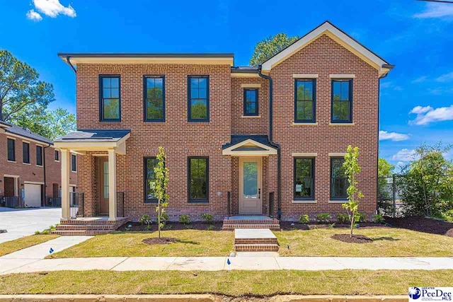 319 Railroad Ave, Florence, SC 29506 - view of front facade with brick siding and a front lawn