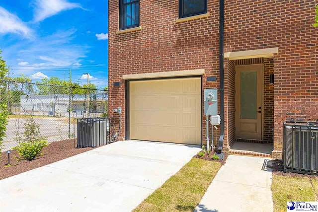 319 Railroad Ave, Florence, SC 29506 - garage with cooling unit and driveway