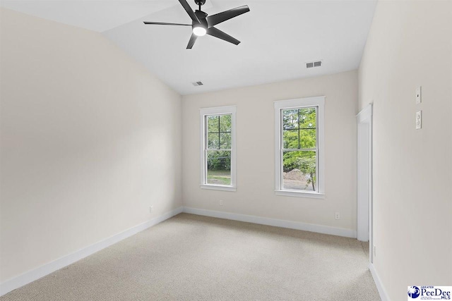 319 Railroad Ave, Florence, SC 29506 - empty room featuring baseboards, light carpet, a ceiling fan, and vaulted ceiling