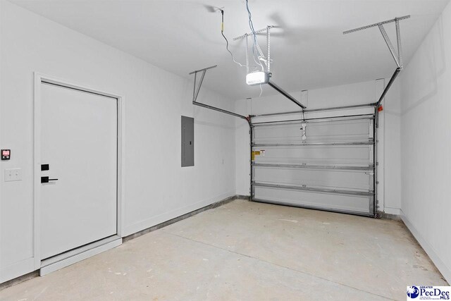 319 Railroad Ave, Florence, SC 29506 - garage with electric panel, a garage door opener, and baseboards