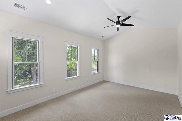 319 Railroad Ave, Florence, SC 29506 - spare room with baseboards, light carpet, ceiling fan, and lofted ceiling
