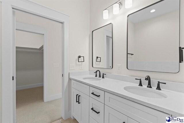 319 Railroad Ave, Florence, SC 29506 - bathroom with double vanity and baseboards