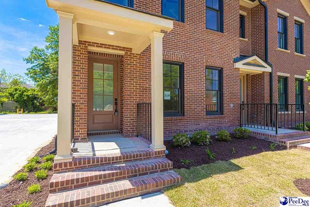 319 Railroad Ave, Florence, SC 29506 - property entrance with brick siding