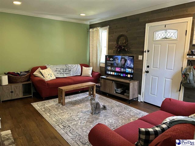 916 Kalmia St, Florence, SC 29501 - living area featuring wood walls, recessed lighting, ornamental molding, and wood finished floors