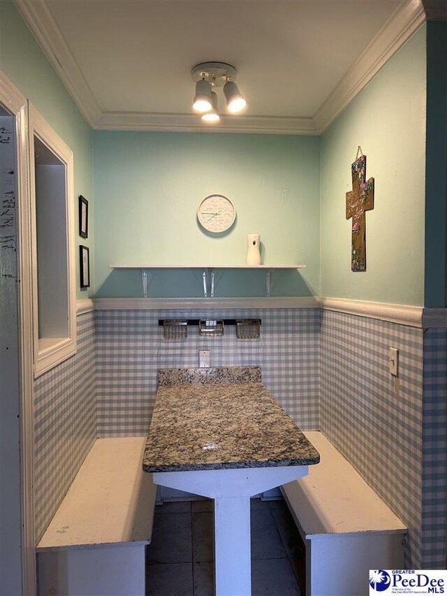 916 Kalmia St, Florence, SC 29501 - kitchen with ornamental molding, wainscoting, and tile patterned flooring