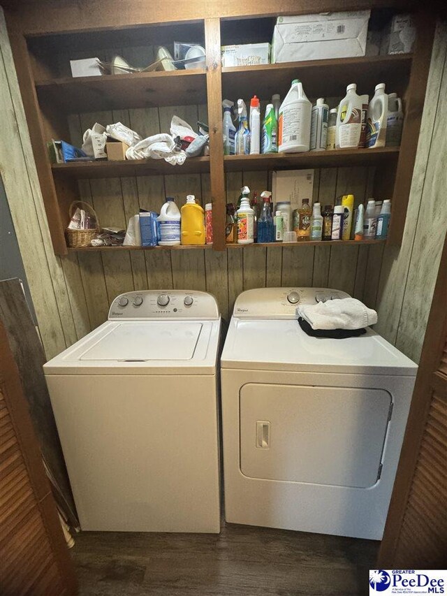washroom featuring separate washer and dryer and dark wood-type flooring