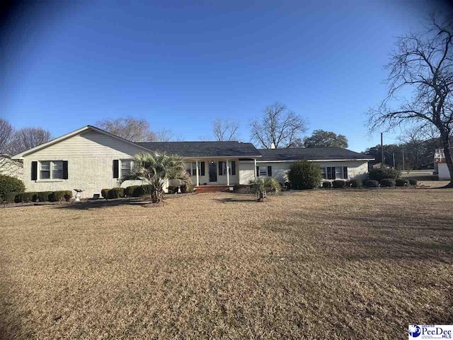 single story home with a front lawn