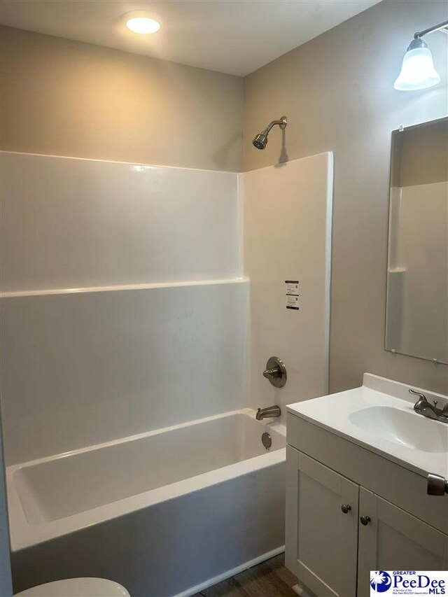 full bathroom with shower / bath combination, vanity, and toilet