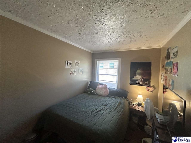 bedroom featuring ornamental molding and a textured ceiling