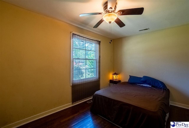 1510 N Rocky Way Dr, Florence, SC 29506 - bedroom featuring baseboards, visible vents, dark wood-style floors, and ceiling fan