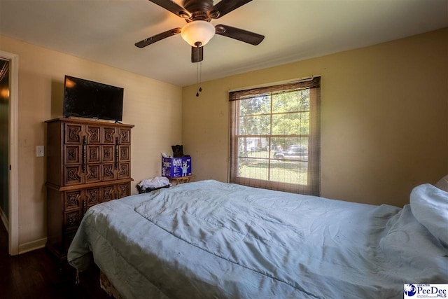 1510 N Rocky Way Dr, Florence, SC 29506 - bedroom featuring ceiling fan, baseboards, and dark wood-style flooring
