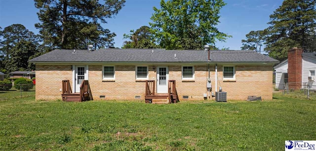 1510 N Rocky Way Dr, Florence, SC 29506 - back of house featuring a yard, central AC unit, crawl space, and fence
