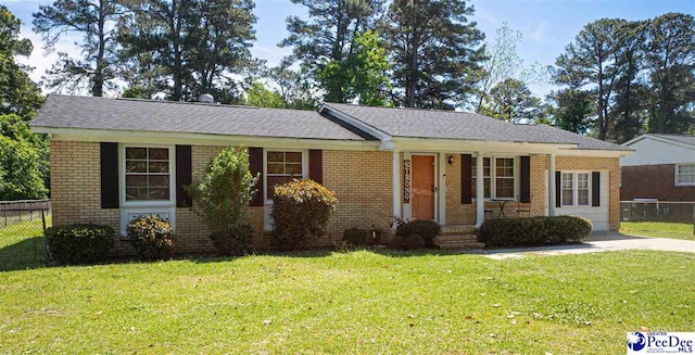 1510 N Rocky Way Dr, Florence, SC 29506 - ranch-style home featuring fence, brick siding, and a front yard