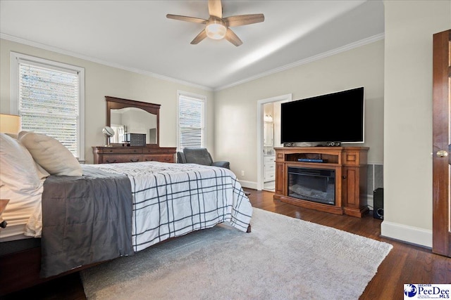 bedroom featuring crown molding, baseboards, and dark wood-style flooring