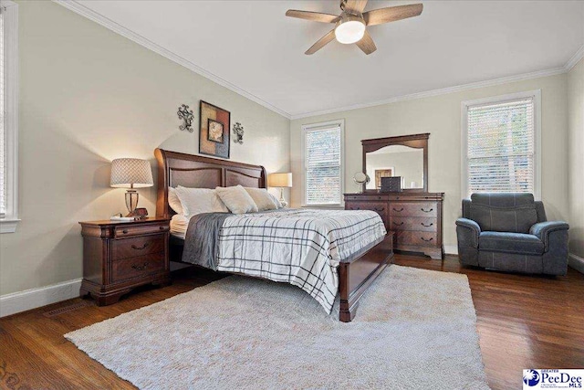 bedroom featuring ornamental molding, ceiling fan, baseboards, and wood finished floors