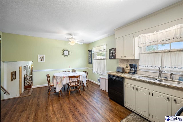 908 Clarendon Ave, Florence, SC 29505 - kitchen featuring dishwasher, a sink, dark wood-style floors, a ceiling fan, and baseboards