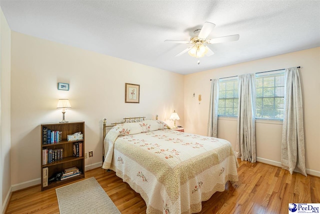 908 Clarendon Ave, Florence, SC 29505 - bedroom with light wood-style flooring, baseboards, and ceiling fan
