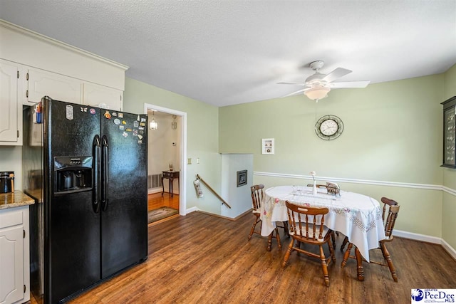 908 Clarendon Ave, Florence, SC 29505 - dining area featuring wood finished floors, a ceiling fan, and baseboards