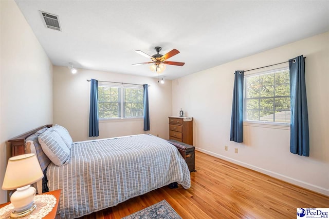 908 Clarendon Ave, Florence, SC 29505 - bedroom with wood finished floors, baseboards, and a ceiling fan
