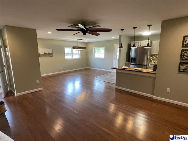 1429 E Home Ave, Hartsville, SC 29550 - unfurnished living room featuring a ceiling fan, recessed lighting, dark wood finished floors, and baseboards