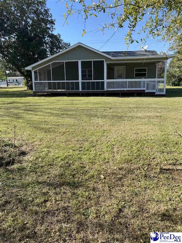 1429 E Home Ave, Hartsville, SC 29550 - view of front of home with a front yard and a sunroom