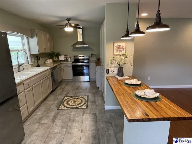 1429 E Home Ave, Hartsville, SC 29550 - kitchen featuring wooden counters, stainless steel appliances, wall chimney exhaust hood, a sink, and ceiling fan