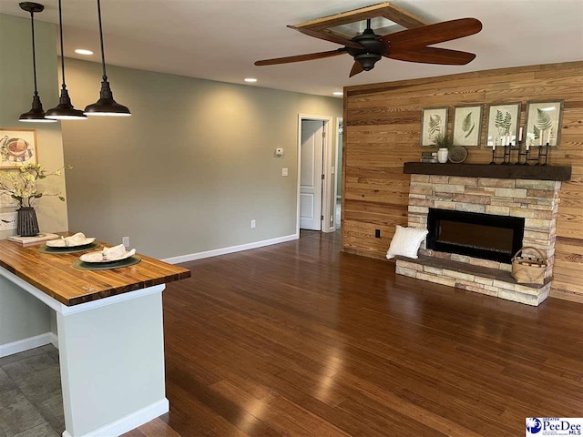 1429 E Home Ave, Hartsville, SC 29550 - unfurnished living room featuring a ceiling fan, recessed lighting, baseboards, a fireplace, and dark wood-type flooring