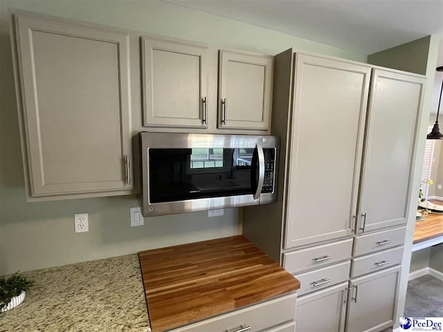 1429 E Home Ave, Hartsville, SC 29550 - kitchen with stainless steel microwave and wooden counters