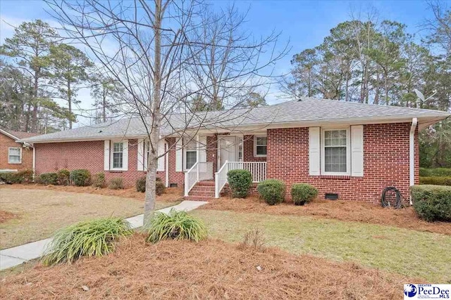 ranch-style house with brick siding, crawl space, and a shingled roof