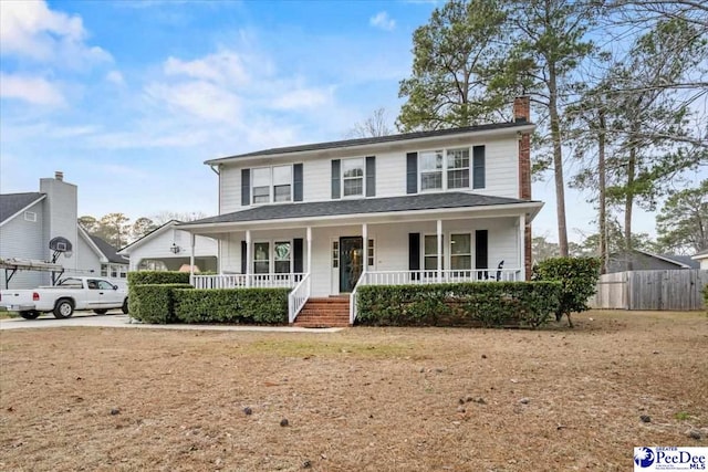 view of front of home featuring a porch and a front lawn