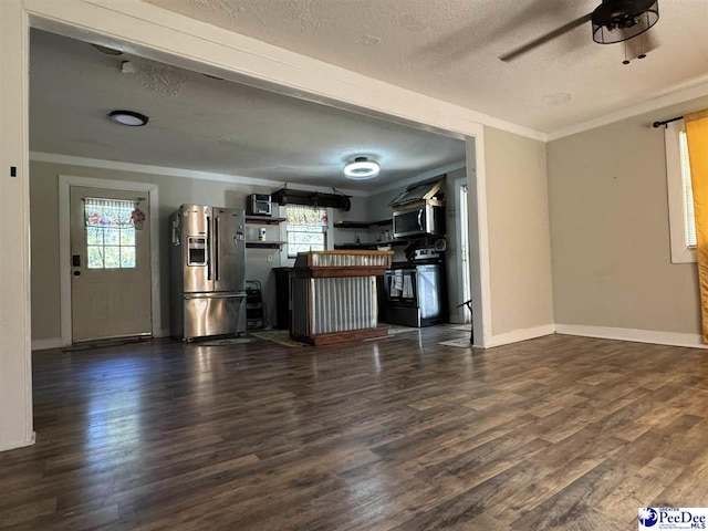 unfurnished living room with crown molding, dark wood-type flooring, and a wealth of natural light