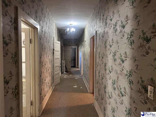 204 Witcover St, Marion, SC 29571 - corridor featuring a chandelier, wallpapered walls, baseboards, and carpet
