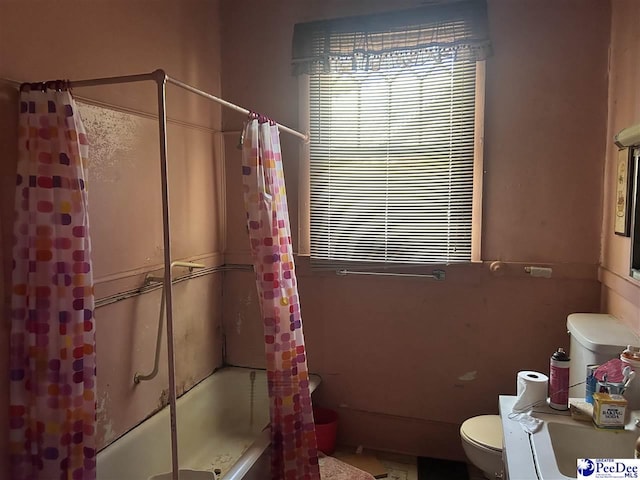 204 Witcover St, Marion, SC 29571 - bathroom with toilet and shower / bath combo with shower curtain