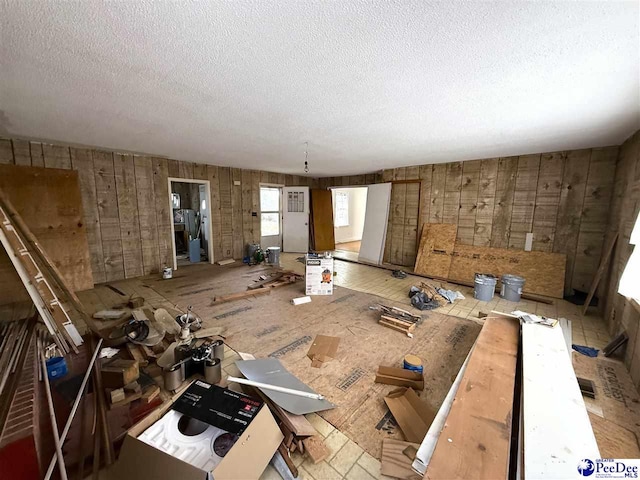 unfurnished room featuring a textured ceiling