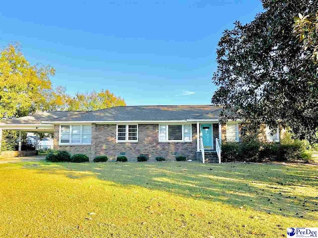 ranch-style house featuring a front lawn