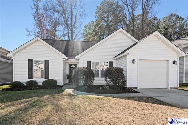 ranch-style home with driveway, a front lawn, and an attached garage