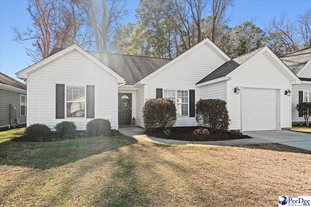 ranch-style home with a garage, a front lawn, and concrete driveway