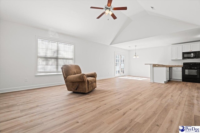 unfurnished room with ceiling fan, light wood finished floors, baseboards, and a healthy amount of sunlight