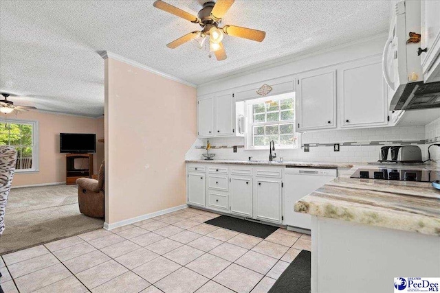 kitchen featuring white appliances, light countertops, white cabinets, a ceiling fan, and backsplash