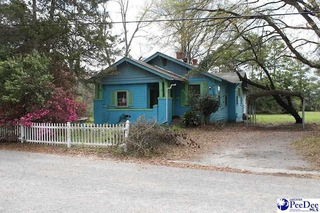 view of front facade with a carport