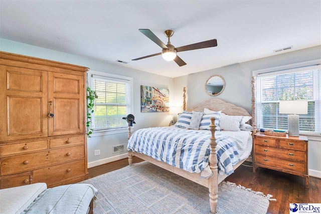 bedroom featuring ceiling fan and dark hardwood / wood-style flooring