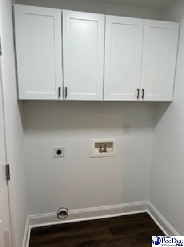 washroom featuring washer hookup, baseboards, cabinet space, dark wood-style floors, and electric dryer hookup