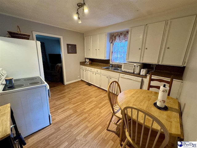 66 Victory Dr, Cheraw, SC 29520 - kitchen with white appliances, white cabinets, a textured ceiling, a sink, and light wood-type flooring