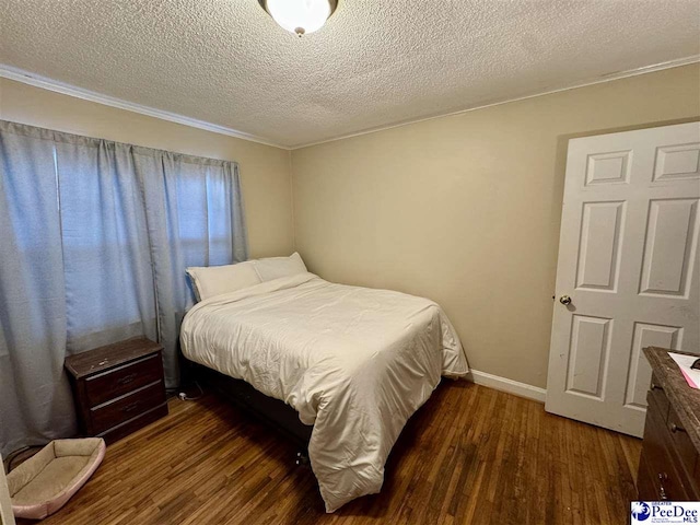 66 Victory Dr, Cheraw, SC 29520 - bedroom with a textured ceiling, wood finished floors, baseboards, and ornamental molding