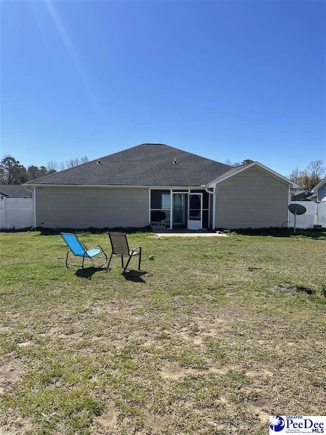 3007 Colton Dr, Florence, SC 29506 - rear view of property with a patio area, a shingled roof, a yard, and fence