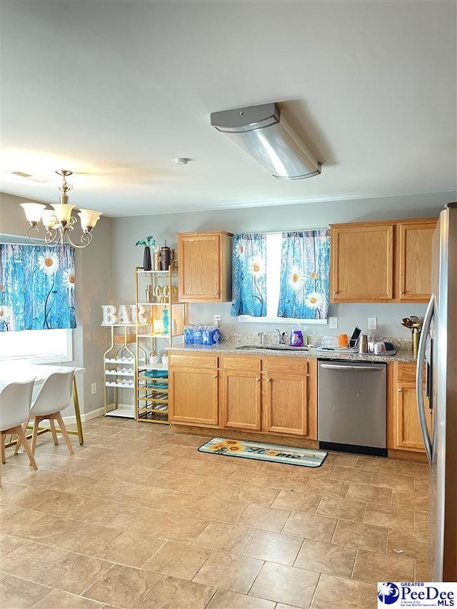 3007 Colton Dr, Florence, SC 29506 - kitchen featuring a chandelier, stainless steel appliances, light stone counters, and a sink